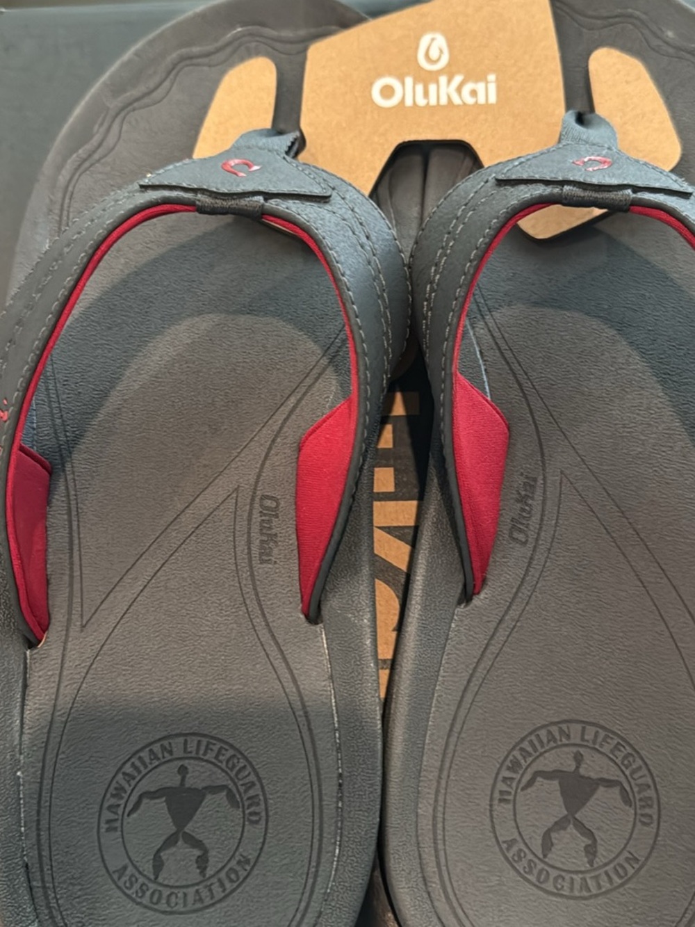 OluKai Men’s Gray Flip-Flops with Red Accents